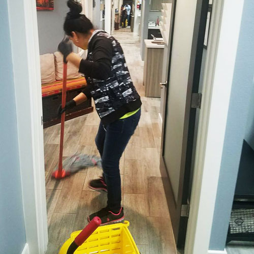 Worker mopping floor